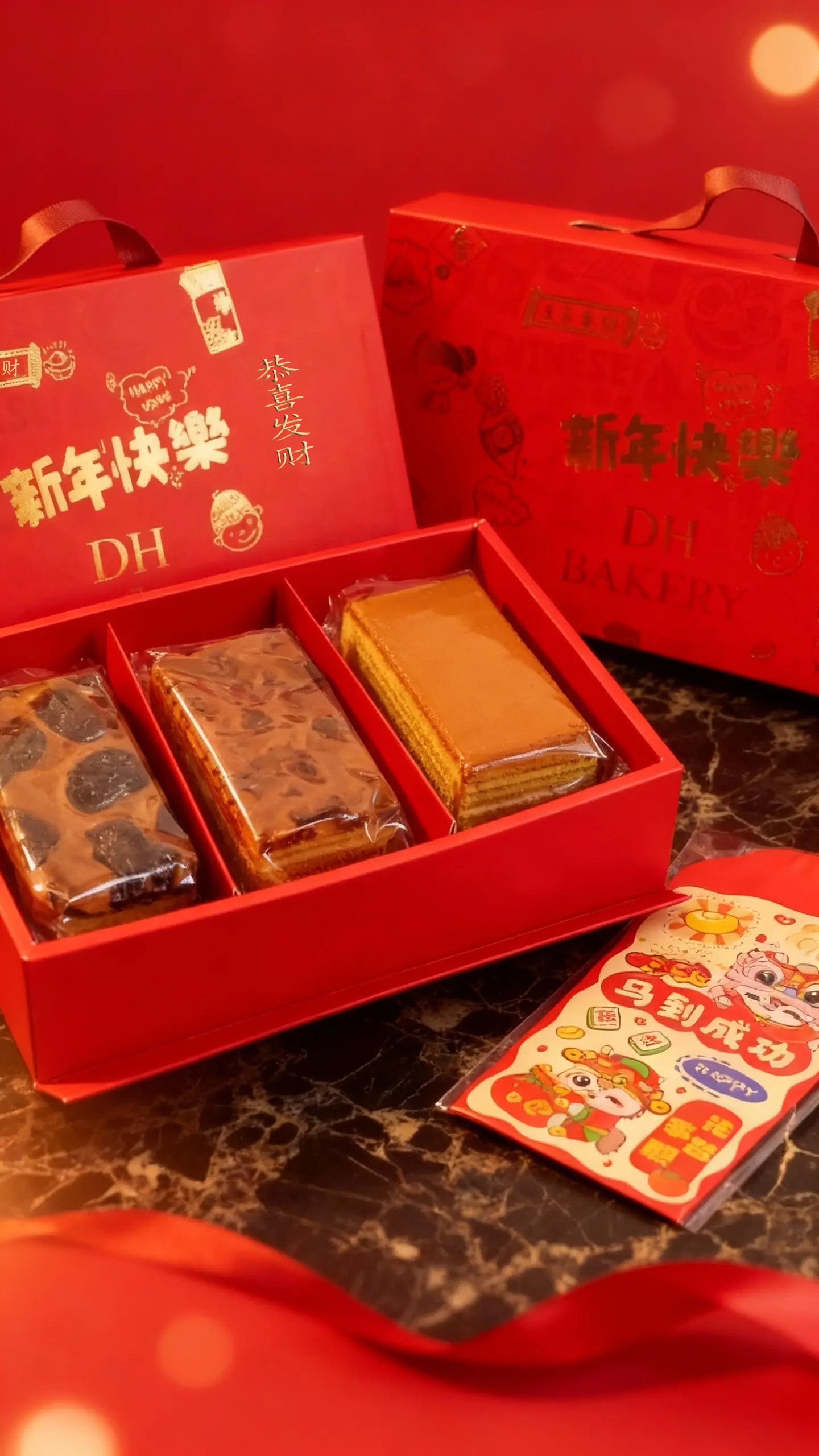 Red gift box with Chinese New Year-themed items on a red background